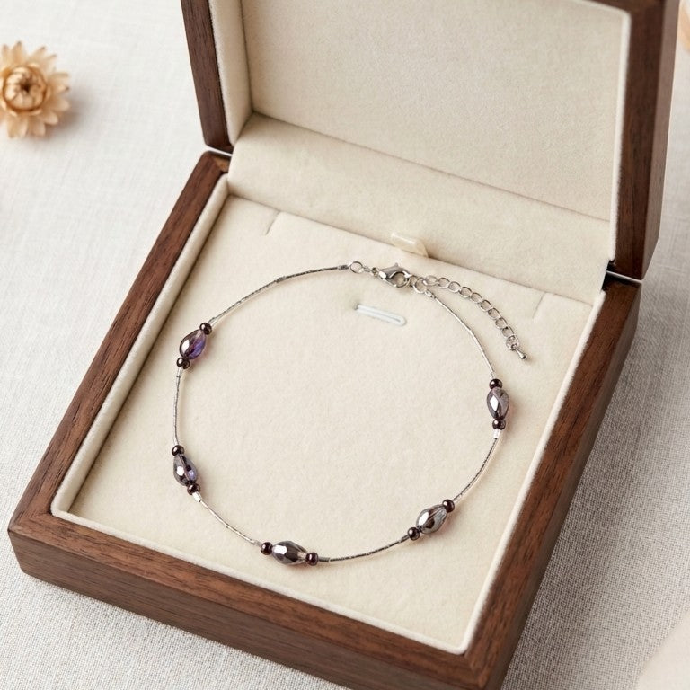 Floating bead chain necklace, displayed  in a jewellery box.